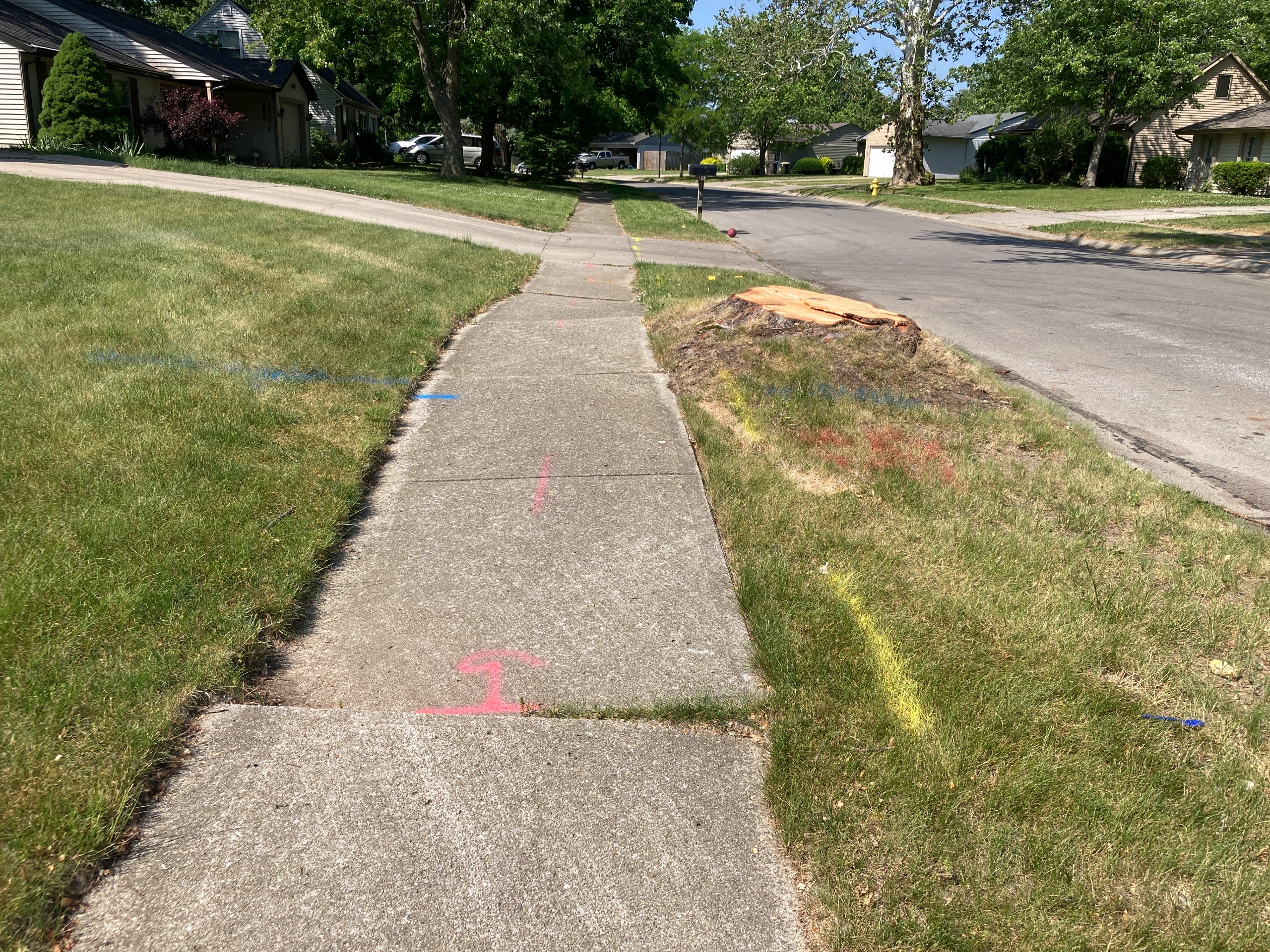 Before: This  sidewalk was lifted, making it difficult for some pedestrians to use.