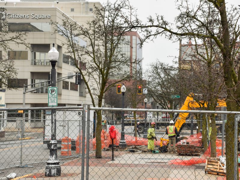 A construction crew works on the downtown public bathroom