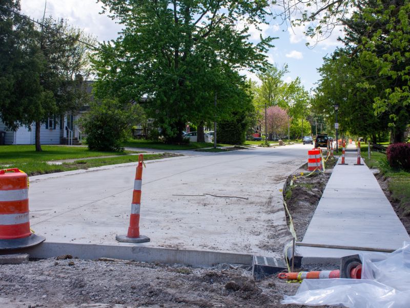 A new street can be seen, with construction barrels lining the street
