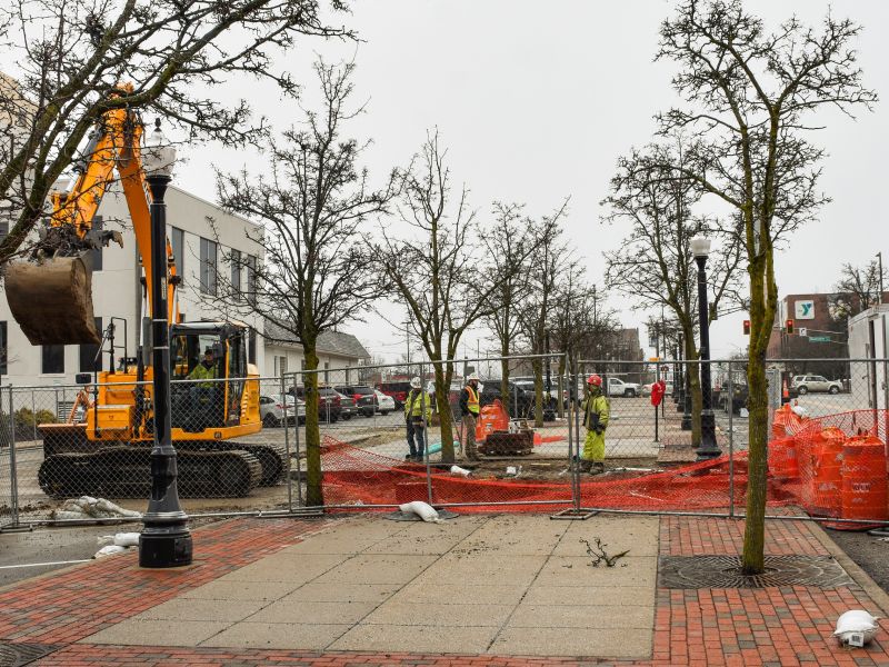 A construction crew works on the downtown public bathroom