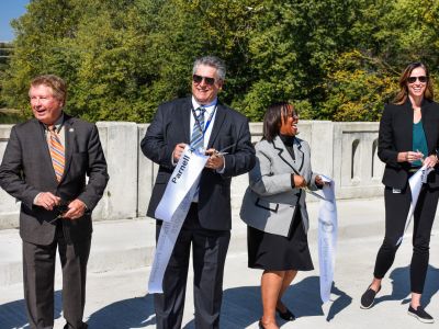 Mayor Sharon Tucker and City Staff cut the ribbon to open Parnell Ave. Bridge